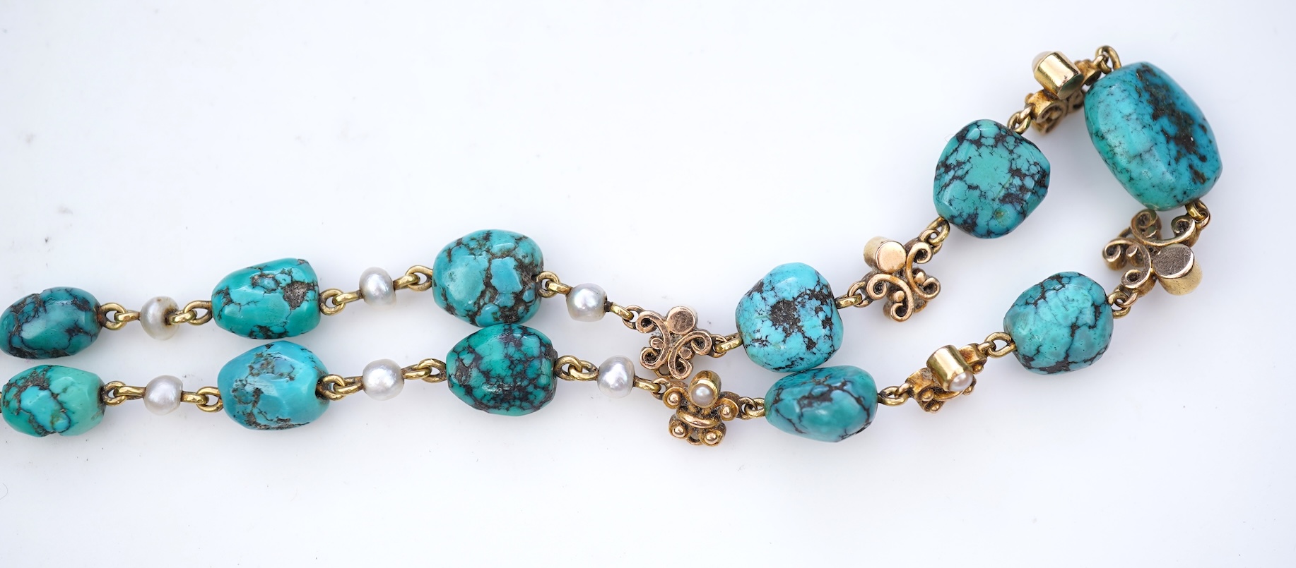 A turquoise and seed pearl necklace, early 20th century